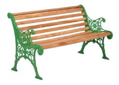 A GREEN PAINTED CAST IRON GARDEN BENCH IN VICTORIAN STYLE