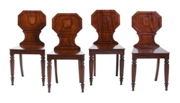 A SET OF FOUR EARLY VICTORIAN MAHOGANY HALL CHAIRS