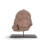 AN INDIAN CARVED STONE HEAD