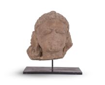 AN INDIAN CARVED STONE HEAD