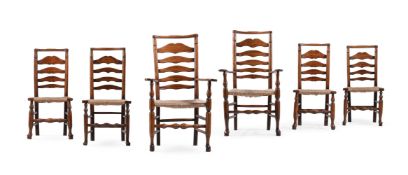A HARLEQUIN SET OF SIX ASH LADDER BACK DINING CHAIRS