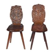 TWO SIMILAR SWISS CARVED WALNUT STABELLE OR HALL CHAIRS