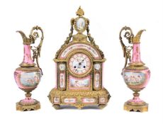 A FRENCH GILT METAL MOUNTED AND PINK PORCELAIN SEVRES STYLE CLOCK GARNITURE