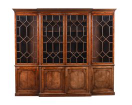 A MAHOGANY BREAK FRONT BOOK CASE IN GEORGE III STYLE