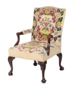 A WALNUT AND NEEDLEWORK UPHOLSTERED OPEN ARMCHAIR, IN GEORGE III STYLE
