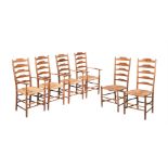 A SET OF FOUR ARTS AND CRAFTS OAK AND RUSH SEATED HIGH BACK ARMCHAIRS