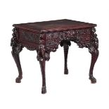 A CARVED HARDWOOD TABLE IN 19TH CENTURY CHINESE STYLE