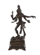 AN INDIAN PATINATED METAL FIGURE OF SHIVA