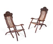 Y A PAIR OF ANGLO-INDIAN CARVED ROSEWOOD FOLDING ARMCHAIRS, CIRCA 1900