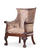 A CARVED MAHOGANY FRAMED LIBRARY ARMCHAIR IN GEORGE II STYLE, 19TH CENTURY