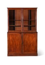 A REGENCY MAHOGANY CABINET BOOKCASE, CIRCA 1815