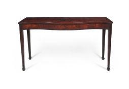 A GEORGE III MAHOGANY SERPENTINE FRONTED CONSOLE TABLE IN THE MANNER OF THOMAS CHIPPENDALE
