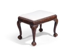AN UNUSUAL 'GRAINED' AND CARVED WOOD STOOL, LATE 19TH OR EARLY 20TH CENTURY