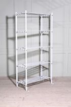 A SET OF WHITE PAINTED METAL SHELVES, BY DREW PRITCHARD LTD.