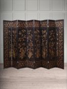 A CHINESE EXPORT BLACK LACQUER AND CHINOISERIE DECORATED EIGHT FOLD SCREEN, EARLY 19TH CENTURY
