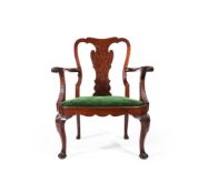 A CARVED MAHOGANY AND 'PLUM PUDDING' MAHOGANY OPEN ARMCHAIR, IN GEORGE II STYLE