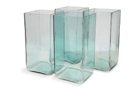 A SET OF FOUR LARGE GLASS BATTERY ACID JARS, CIRCA 1900
