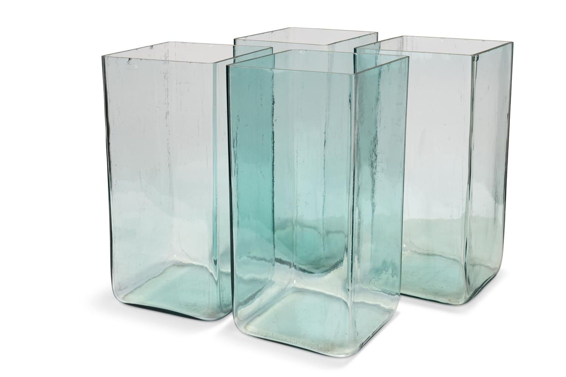 A SET OF FOUR LARGE GLASS BATTERY ACID JARS, CIRCA 1900