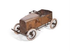 A CHILD'S TIN MODEL PEDAL CAR, EARLY 20TH CENTURY