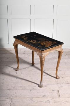 A GEORGE I GILTWOOD, GESSO, BLACK LACQUER AND JAPANNED CENTRE TABLE, CIRCA 1720