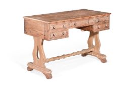 A VICTORIAN PITCH PINE DRESSING OR WRITING TABLE, BY HOWARD & SONS, CIRCA 1850