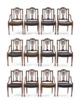 A SET OF TWELVE FINE GEORGE III MAHOGANY ARMCHAIRS, CIRCA 1790