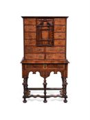 A FINE AND RARE WILLIAM & MARY YEW, BURR YEW AND WALNUT CROSSBANDED CABINET ON STAND