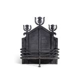 AN ARTS AND CRAFTS WROUGHT IRON FIREGRATE PROBABLY RETAILED BY LIBERTY & CO.