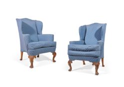 A PAIR OF CARVED WALNUT, BEECH AND UPHOLSTERED WING ARMCHAIRS, EARLY 20TH CENTURY