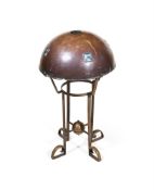 AN ARTS AND CRAFTS HAMMERED COPPER AND BRASS TABLE LAMP IN THE MANNER OF LIBERTY & CO.