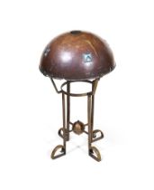 AN ARTS AND CRAFTS HAMMERED COPPER AND BRASS TABLE LAMP IN THE MANNER OF LIBERTY & CO.