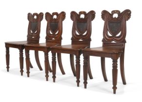 A SET OF FOUR REGENCY OAK HALL CHAIRS, CIRCA 1820