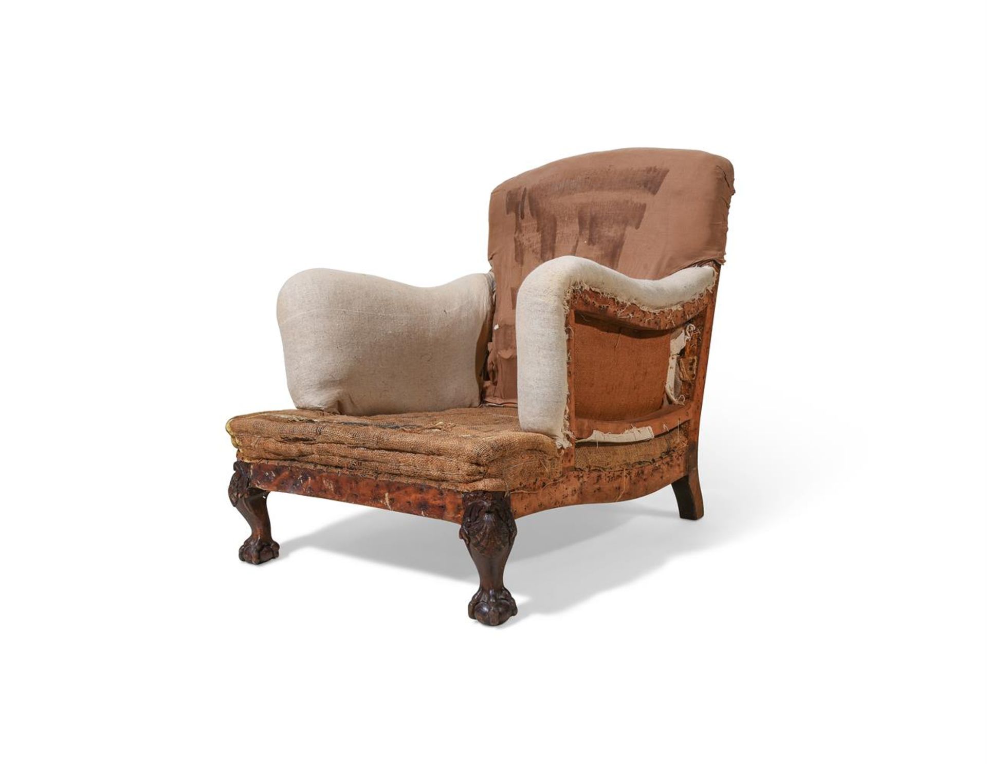 A CARVED WALNUT 'RAMSDEN' ARMCHAIR, ALMOST CERTAINLY BY HOWARD & SONS