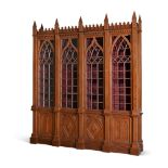A VICTORIAN OAK LIBRARY BOOKCASE IN GOTHIC REVIVAL TASTE, SECOND HALF 19TH CENTURY