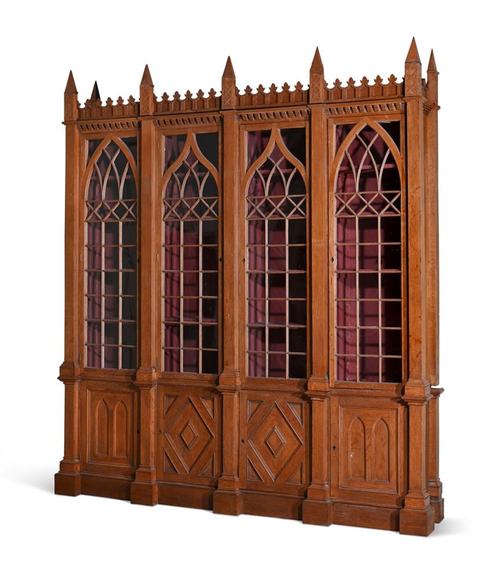 A VICTORIAN OAK LIBRARY BOOKCASE IN GOTHIC REVIVAL TASTE, SECOND HALF 19TH CENTURY