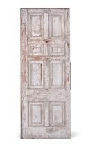 A LARGE GEORGE III CARVED AND PAINTED PINE SECTION OF ROOM PANELLING