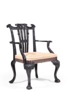 A CARVED MAHOGANY OPEN ARMCHAIR IN GEORGE II IRISH STYLE, LATE 19TH OR EARLY 20TH CENTURY