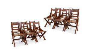 A SET OF TWELVE PITCH PINE GOTHIC REVIVAL SIDE CHAIRS, CIRCA 1890