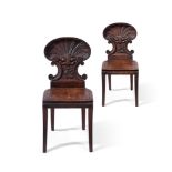 A PAIR OF VICTORIAN CARVED OAK HALL CHAIRS, ATTRIBUTED TO GILLOWS, CIRCA 1860