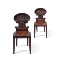 A PAIR OF VICTORIAN CARVED OAK HALL CHAIRS, ATTRIBUTED TO GILLOWS, CIRCA 1860