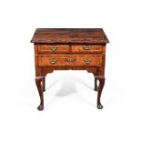A GEORGE II WALNUT AND CROSSBANDED SIDE TABLE, CIRCA 1740