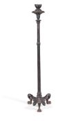 A BLACK PAINTED AND PARCEL GILT CAST IRON TORCHERE, IN THE HERCULANEUM MANNER, 19TH CENTURY