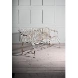 A WHITE PAINTED WROUGHT IRON GARDEN BENCH IN REGENCY STYLE, 20TH CENTURY