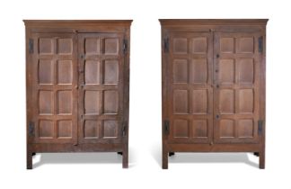 A RARE PAIR OF CHARLES II PAINTED OAK PANELLED CUPBOARDS OR ESTATE CABINETS, CIRCA 1680