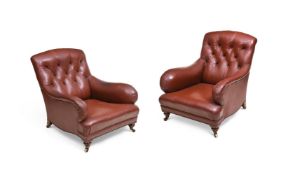 A PAIR OF WALNUT AND LEATHER UPHOLSTERED ARMCHAIRS AFTER THE HOWARD AND SONS 'BRIDGEWATER' DESIGN