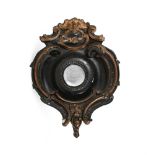 OF NAVAL INTEREST: A CARVED, EBONISED AND PARCEL GILT SHIP’S MIRROR, LATE 19TH OR EARLY 20TH CENTURY