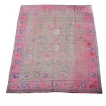 A WOVEN CARPET, PROBABLY DONEGAL, OF USHAK DESIGN