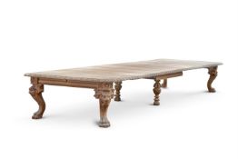 A LARGE AND IMPRESSIVE VICTORIAN CARVED OAK EXTENDING DINING TABLE