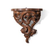 A LARGE CARVED AND GRAINED WALL BRACKET, 19TH CENTURY