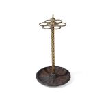 A VICTORIAN BRASS AND CAST IRON CIRCULAR STICK STAND, LATE 19TH CENTURY